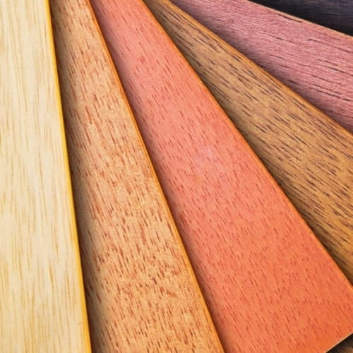 Yellow, orange, and red hues of wooden panels spread apart